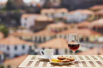 Madeira wine, coffee and hohey cake, View to Funchal, Portugal