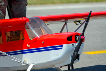 Homemade radio control aircraft on blue sky.