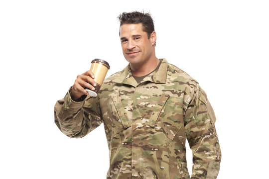 Smiling soldier drinking coffee