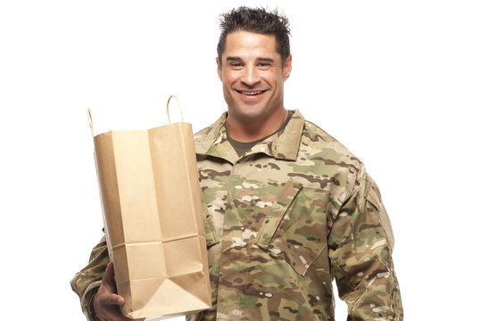 Happy army soldier with shopping bag
