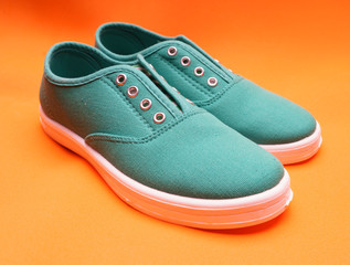 Green Sneakers on Orange