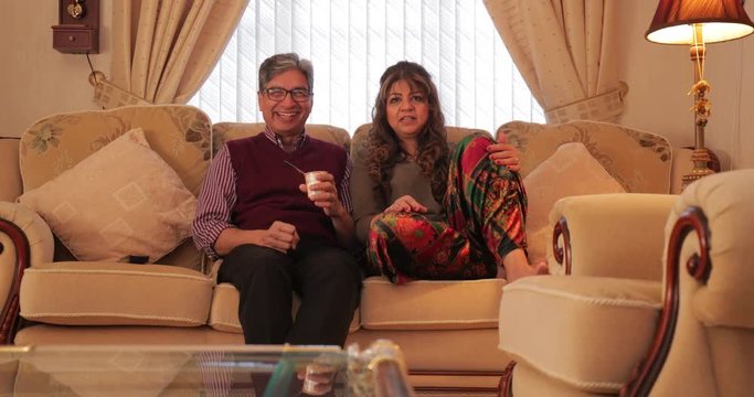 Mature Couple Watching Television