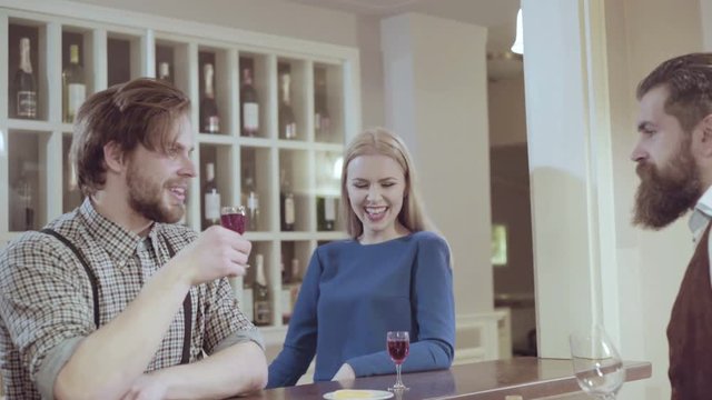 Beautiful couple in a restaurant. Cheerful couple in restaurant making an order. Romantic couple dating in pub