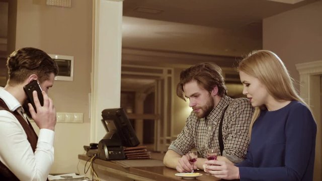 Couple in love. Handsome man flirting with cute woman in restaurant. Bearded man flirting with young sexy blonde