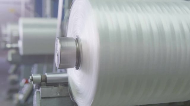 macro bobbins rotate winding fiberglass at light