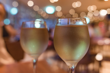 Festive food background of two glasses with white wine