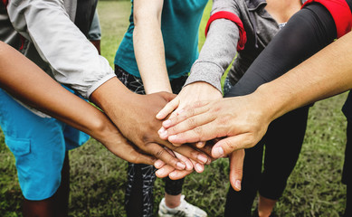 Diverse people stacking their hands