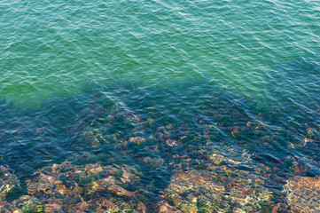 Fototapeta na wymiar Clear, transparent water and rocks nature background