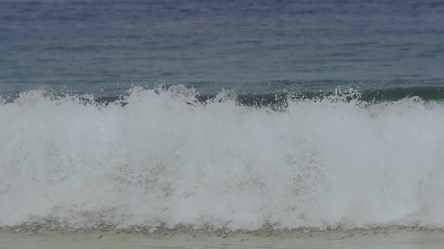 One Big Ocean Wave Breaking In Green Clear Waters In Of The Maldives In Slow Motion.
