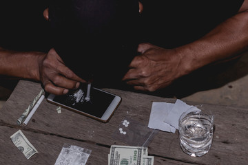 Closeup man using heroin. Narcotic overdose.man addict using cocaine drugs.Drug heroin...