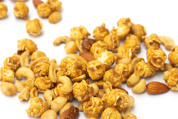 Popcorn and nut with caramel isolated on white background.
