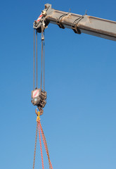 Boom of mobile crane with blue sky background.