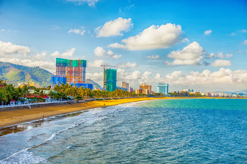 Aerial view of Quy Nhon beach with curved shore line in Binh Dinh province, Vietnam