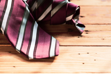 Happy fathers day concept. Close up Red tie on wooden table background.