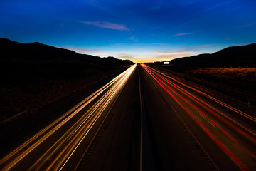MARCH 12, 2017, LAS VEGAS, NV - streaked lights at sunset over Interstate 15, south of Las Vegas,...
