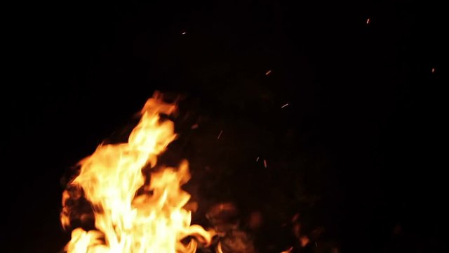 Real fire isolated on black background, loop video