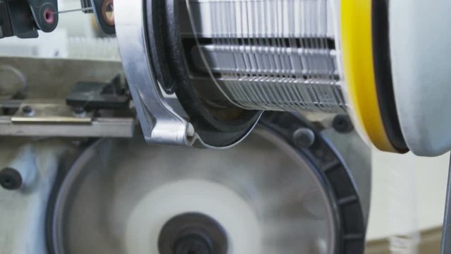 loom weaves material to protect pipes from corrosion