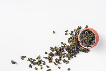 Asia culture and design concept - fresh taiwan oolong tea dry bud in chinese porcelain teacup
