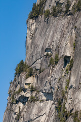 a steep cliff under the blue sky
