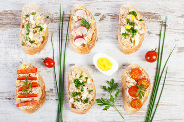Baguette or sandwiches with mackerel or tuna fish paste and ingredients for preparing meal