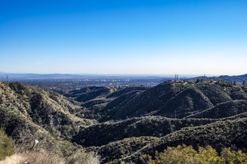 View through the Angeles Crest Mountains down into the San Gabriel Valley on a Bright Sunny Day with a Blue Sky