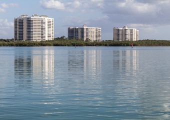 Reflection of Buildings on Calm Bay - 205324557
