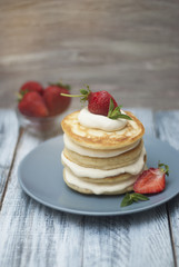 Dessert Pancakes with Cream and Strawbery. Health Breakfast Fruit Berry Vitamine Gray Rustic Wooden Background