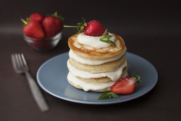 Obraz na płótnie Canvas Dessert Pancakes with Cream and Strawbery. Health Breakfast Fruit Berry Vitamine Black Background