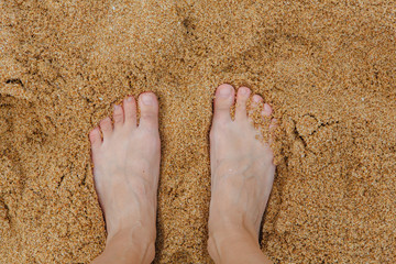 Woman's Bare Feet on the beach.