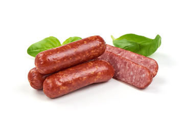Salami smoked sausages with herbs and tomatoes isolated on white background