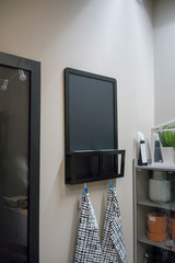 Wooden black chalk board with slot for mail bin and hook for cloth hanging