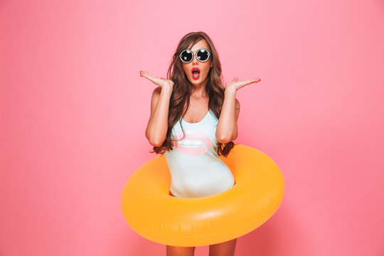 Portrait of a shocked young woman dressed in swimsuit
