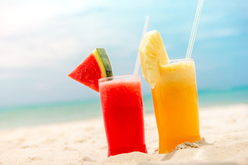 Colorful refreshing cold tropical fruit smoothie drinks
