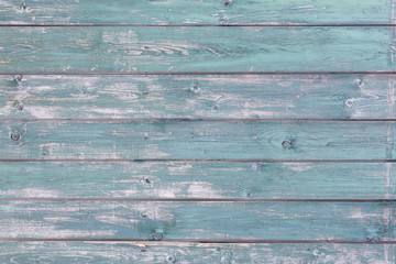 Holzdielen mit abgeblätterter Farbe als Hintergrund