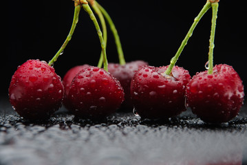  juicy ripe cherry on a black background