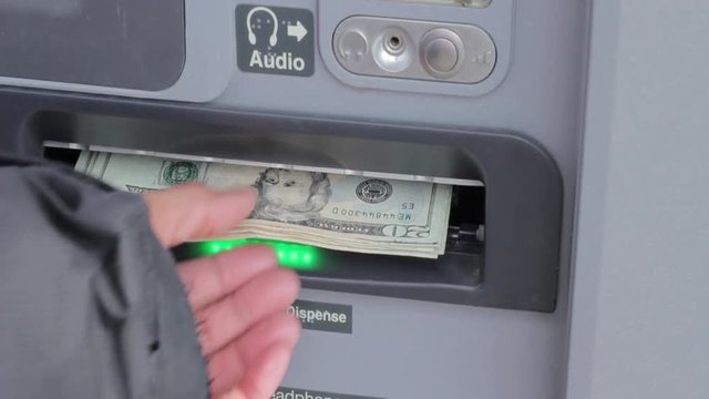 ATM dispensing cash