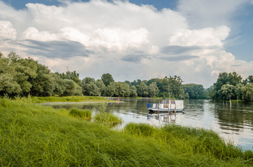 White small wooden boat on the lake