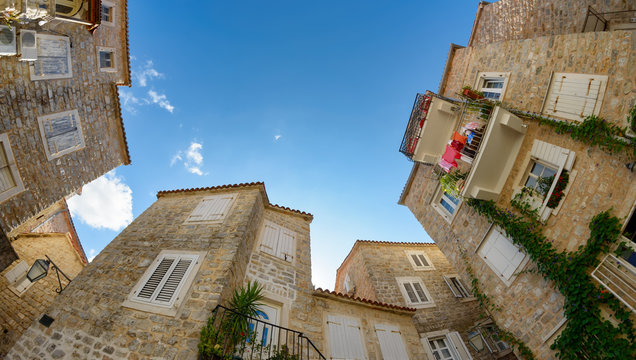 Small piazza with stone houses in the Old Town of Budva, Montenegro, Europe 