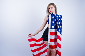 Cute girl in bra and shorts with american usa flag isolated on white background.