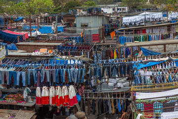 Dhobi Ghat Mumbai Laundry. Dhobi Ghat is a well known open air laundromat in Mumbai, India. The washers, known as dhobis, work in the open to clean clothes and linens from Mumbai's hotels and hospital