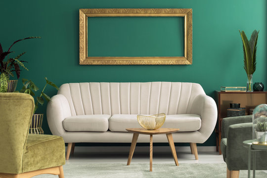 Bright sofa in green interior