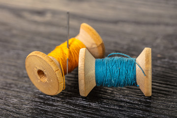 colored threads and needle