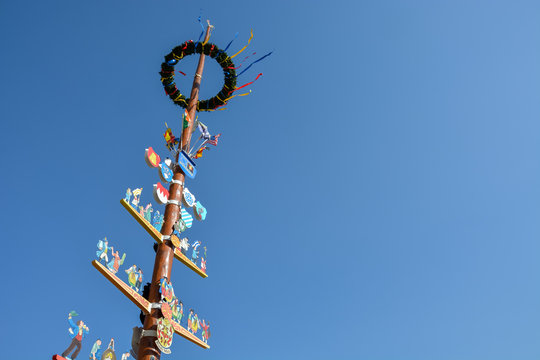 A traditional German "Maibaum" or may pole in Wuerzburg on a sunny day