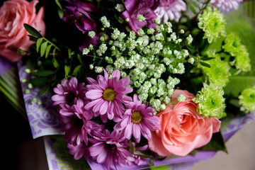 Modern bouquet of roses in rustic style, chrysanthemums, on wooden background