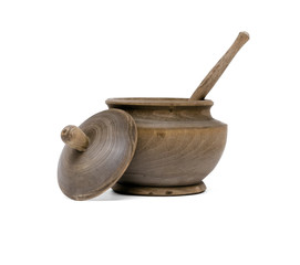 Wooden pot with wood spoon isolated on white background.