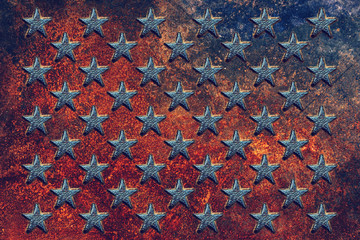 Embossed USA star shapes on rusty metal surface