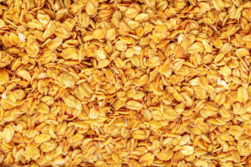 Homemade roasted granola on baking sheet breakfast food background