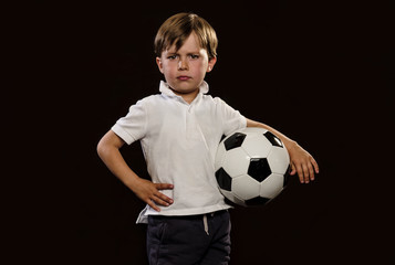 Young child holding a soccer ball