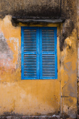 Blue wood window of old house in Hoi An Vietnam