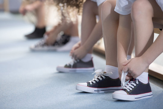 Kids Tying Sport Shoes Close-up